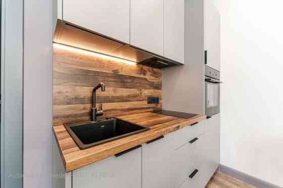 A modern and meticulously designed studio apartment is available for purchase at Ernesta Birznieka-U Rīga