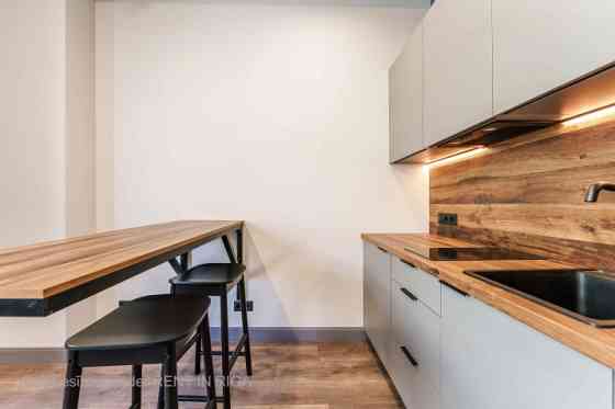 A modern and meticulously designed studio apartment is available for purchase at Ernesta Birznieka-U Rīga