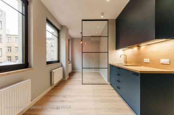 A modern and meticulously designed studio apartment is available for purchase at Ernesta Birznieka-U Rīga