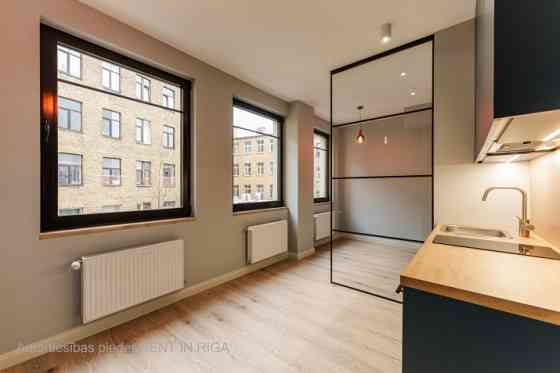 A modern and meticulously designed studio apartment is available for purchase at Ernesta Birznieka-U Rīga