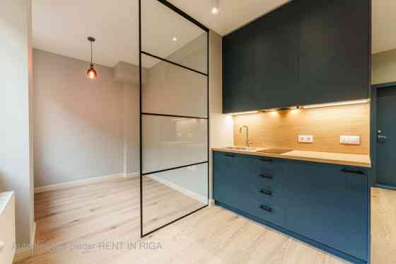 A modern and meticulously designed studio apartment is available for purchase at Ernesta Birznieka-U Rīga