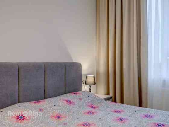 For sale  a bright and cozy two-room apartment with a parking space in the new development Krasta kv Рига