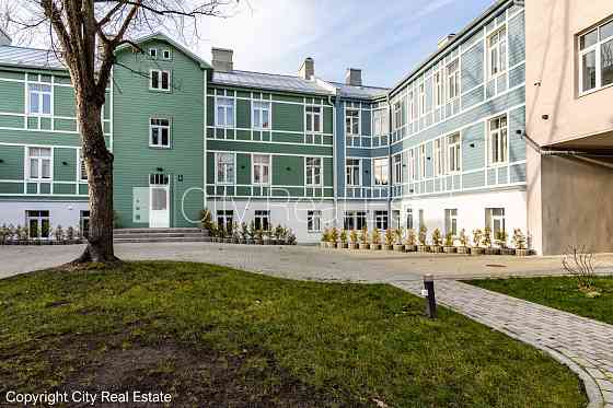 Реставрированный дом, фасад с деревянной отделкой, энергоэффективный дом, Rīga