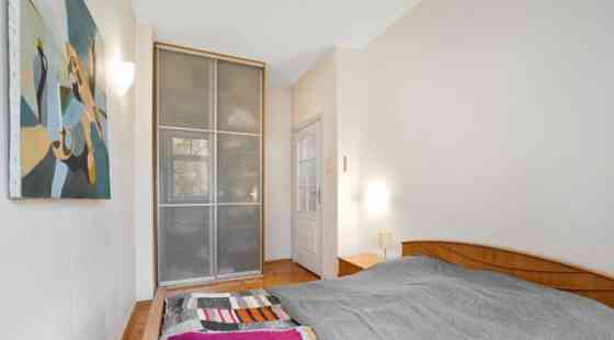 A two-room apartment with separate rooms, a balcony, and a parking space.  The apartment is fully fu Рига