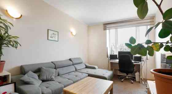 A two-room apartment with separate rooms, a balcony, and a parking space.  The apartment is fully fu Рига