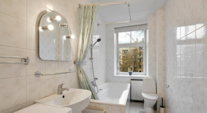 A two-room apartment with separate rooms, a balcony, and a parking space.  The apartment is fully fu Рига - изображение 7