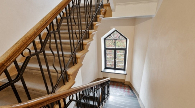 A two-room apartment with separate rooms, a balcony, and a parking space.  The apartment is fully fu Рига - изображение 8