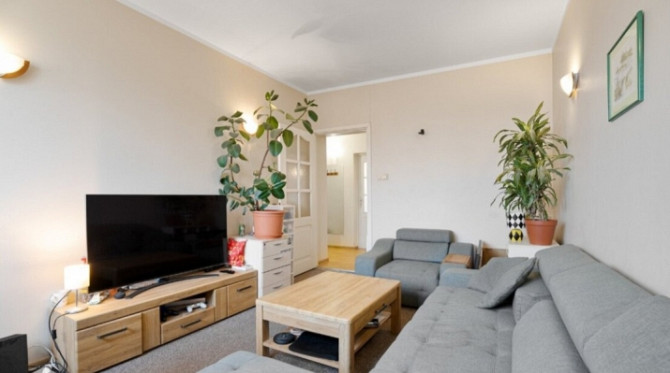 A two-room apartment with separate rooms, a balcony, and a parking space.  The apartment is fully fu Рига - изображение 2