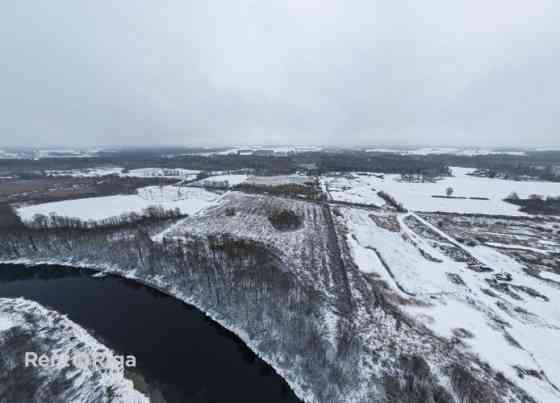 Продаётся инвестиционный объект  земельный участок с действующим карьером и Бауска и Бауский край