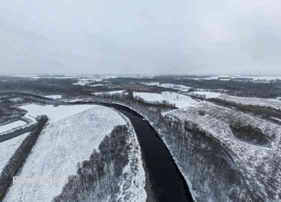 Продаётся инвестиционный объект  земельный участок с действующим карьером и Бауска и Бауский край