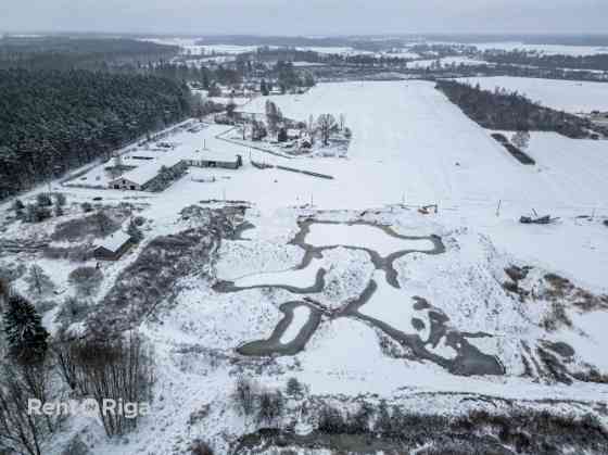 Продаётся инвестиционный объект  земельный участок с действующим карьером и Бауска и Бауский край