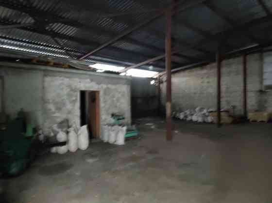 Metal hangar with columns.  Level concrete floor. Inside the hangar there is a 37 sq.m brick buildin Рижский район
