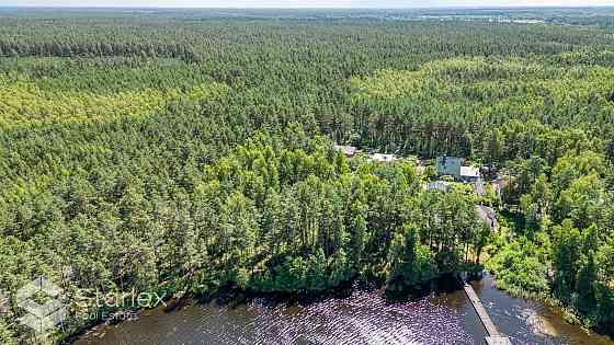 В живописном месте на берегу самого озера Лангстини продается уникальный Рижский район