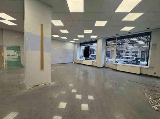 Here are the translations in Russian and English:  Russian:  Writing  Сдаются в аренду торговые поме Rīga