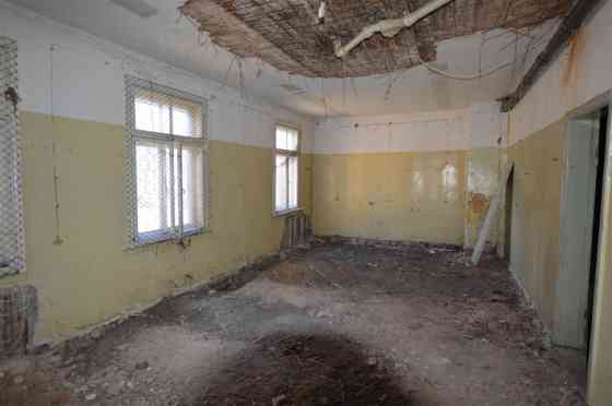 Premises located on the ground floor of a wooden residential building.  Total area of the premises:  Rīga