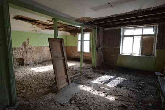 Premises located on the ground floor of a wooden house.  The total area of the premises is 427.6 m.  Рига