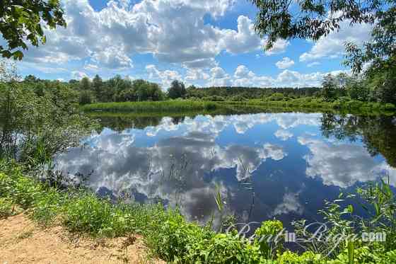 Земельный участок под застройку на первой линии у реки Jugla. Престижное Rīgas rajons