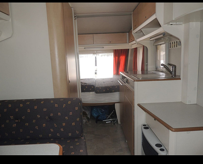 Прекрасный и очень ухоженный прицеп KIP 440 Grey-Line с двумя зонами отдыха, тентом, 3-точечным... Rīga - foto 5