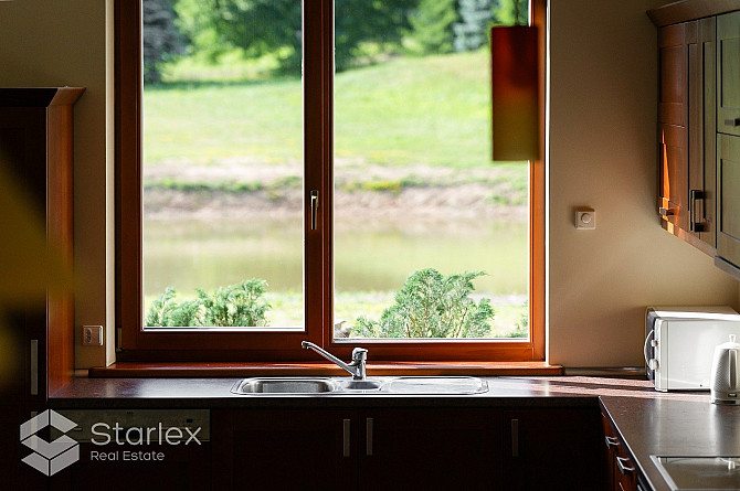 Privātmāja ar skaistu, iekoptu, ainavisku teritoriju. Piedāvājumā uz pirkšanu plaša Rīgas rajons - foto 16