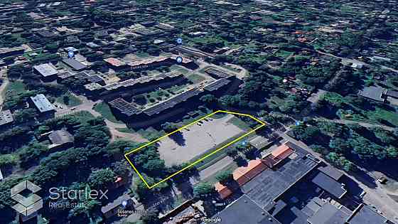 Pārdod zemes gabalu ar platību 4112 m2 Rīgā, Šampēterī. Zemes gabals lielākoties ir asfaltēts un šob Рижский район