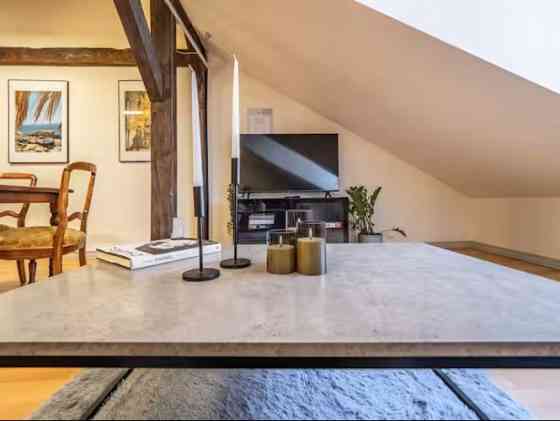 Комфортная и со вкусом обставленная двухуровневая квартира в стиле loft в самом Рига