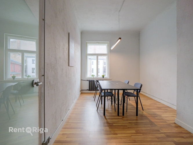 Office with a creative industrial atmosphere  high ceilings, wooden plank floors, exposed wooden bea Рига - изображение 9