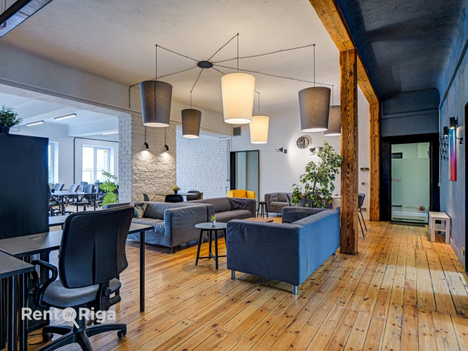 Office with a creative industrial atmosphere  high ceilings, wooden plank floors, exposed wooden bea Рига - изображение 5