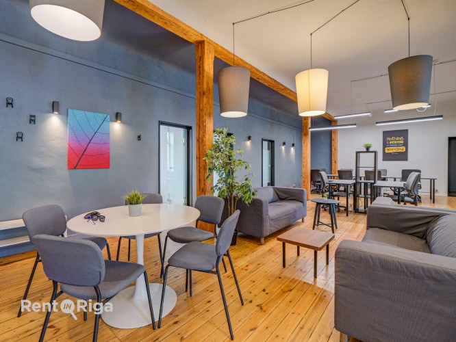 Office with a creative industrial atmosphere  high ceilings, wooden plank floors, exposed wooden bea Рига - изображение 1