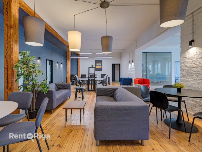 Office with a creative industrial atmosphere  high ceilings, wooden plank floors, exposed wooden bea Рига - изображение 2