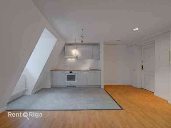 Two-Level Apartment in Jacob's Barracks  The first level features a spacious kitchen, a separate bed Rīga