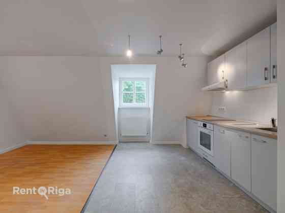 Two-Level Apartment in Jacob's Barracks  The first level features a spacious kitchen, a separate bed Rīga