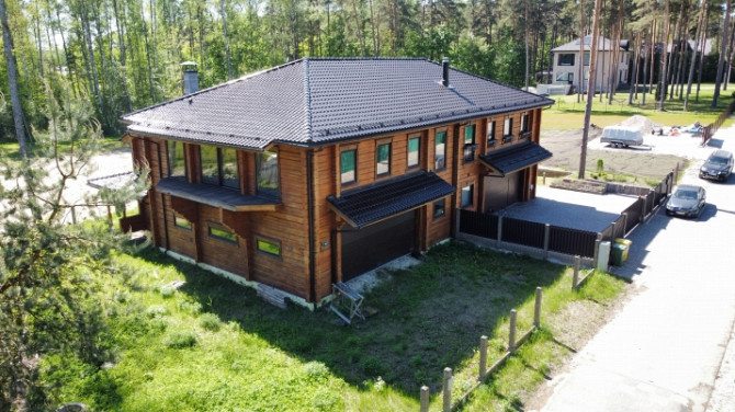 Nestandarta māja pie Baltezera.  Puse no dvīņu mājas. Guļbūve. Ēkas 1.stāvs būvēts kā Rīgas rajons - foto 1