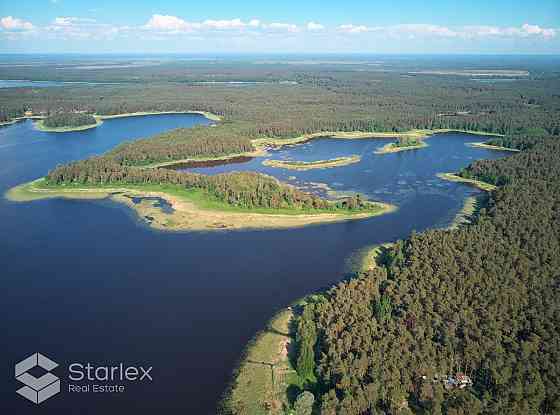Эксклюзивный земельный участок площадью 74 га состоящий из озера и соснового Рижский район
