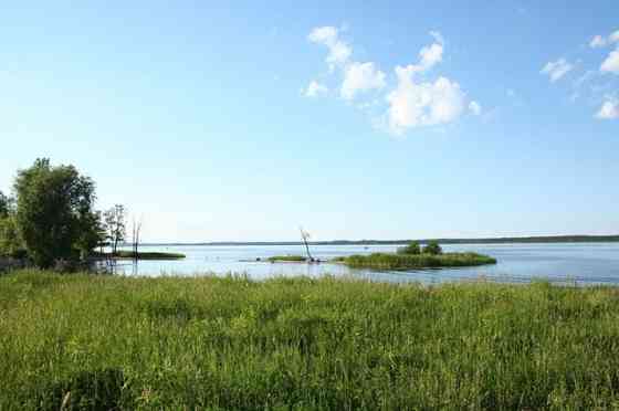 Продается земля на самом берегу озера Кишезерс со стороны Риги. - Можно строить Рига
