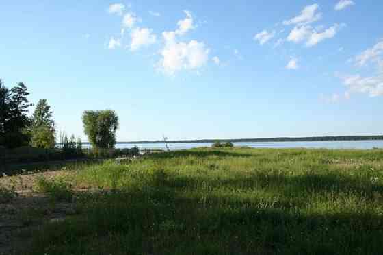 Продается земля на самом берегу озера Кишезерс со стороны Риги. - Можно строить Рига
