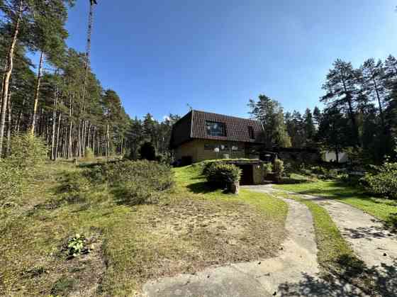 Private house in a scenic location with auxiliary buildings of various sizes and a large land plot.  Rīgas rajons