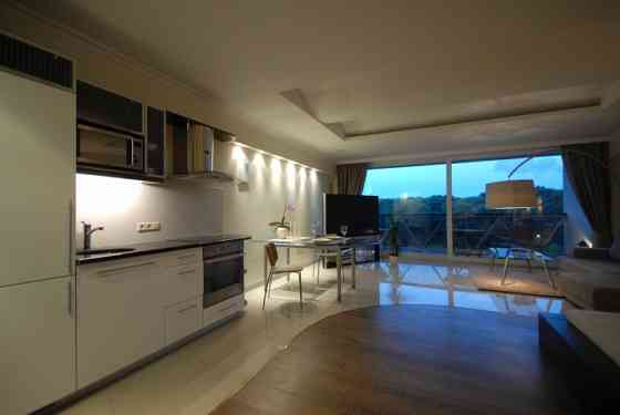 Эксклюзивные апартаменты класса Deluxe с большой террасой и панорамными окнами  - Рига