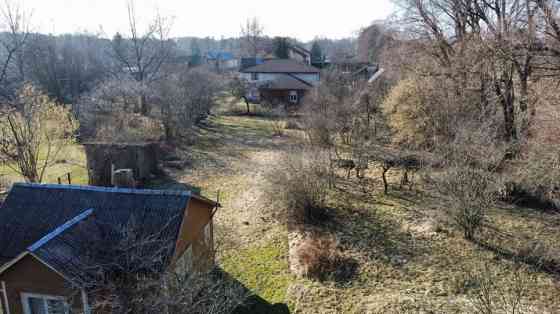 A large plot of land with an area of 2175m2 in a residential area in Melluži. 7 minutes on foot to t Юрмала