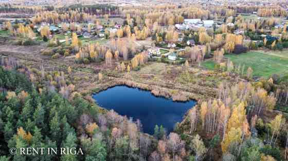 Продаётся земельный участок с водоёмом в Krogsils.  Площадь 19700 м   DzM - район Кекавская вол.