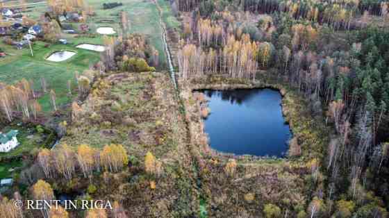 Продаётся земельный участок с водоёмом в Krogsils.  Площадь 19700 м   DzM - район Ķekavas pagasts