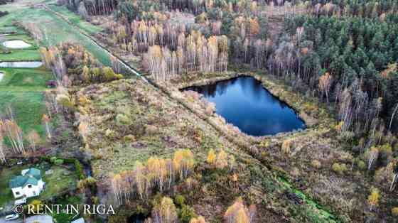 Продаётся земельный участок с водоёмом в Krogsils.  Площадь 19700 м   DzM - район Кекавская вол.