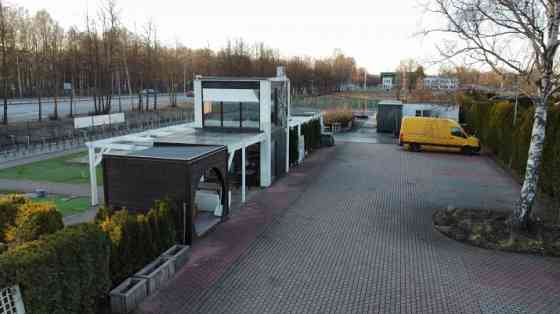 A land plot located along Kārļa Ulmaņa gatve, at the intersection with Gramzdas Street. Currently, a Rīga