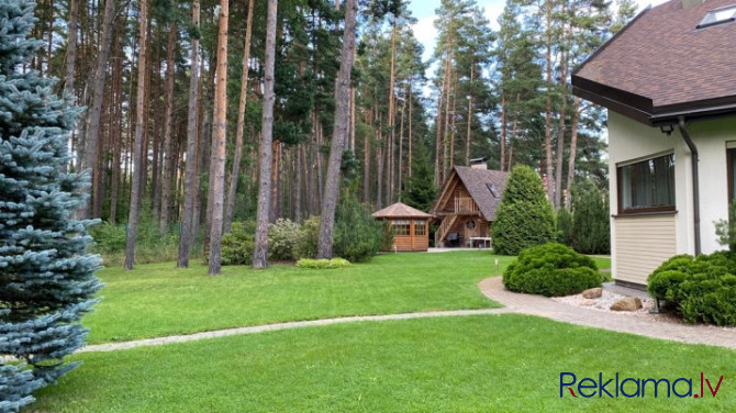 Tiek pārdota gaiša, omulīga, labi uzturēta māja ar kamīnu un tradicionālu koka guļbaļķu Jūrmala - foto 3