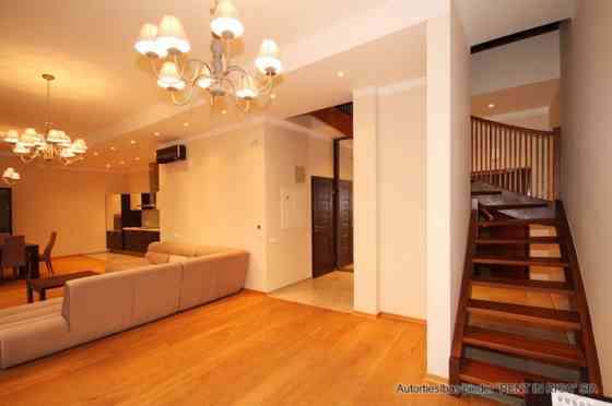 A two-story apartment with a spacious terrace is for sale. The apartment has three separate bedrooms Рига