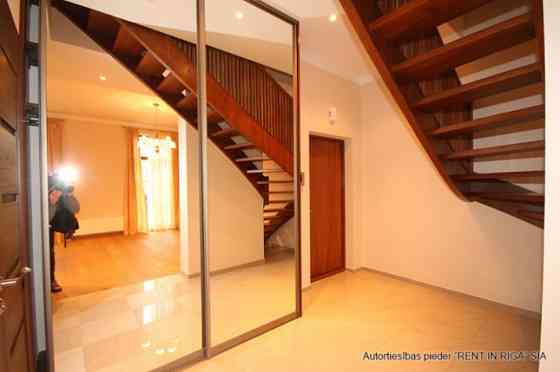 A two-story apartment with a spacious terrace is for sale. The apartment has three separate bedrooms Рига