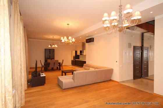 A two-story apartment with a spacious terrace is for sale. The apartment has three separate bedrooms Rīga