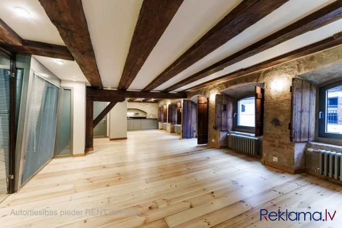 A stylish office in a renovated building in Rigas Old Town. It features preserved original wooden be Рига - изображение 4